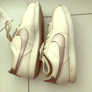 Nike rose gold and cream colored Nike’s